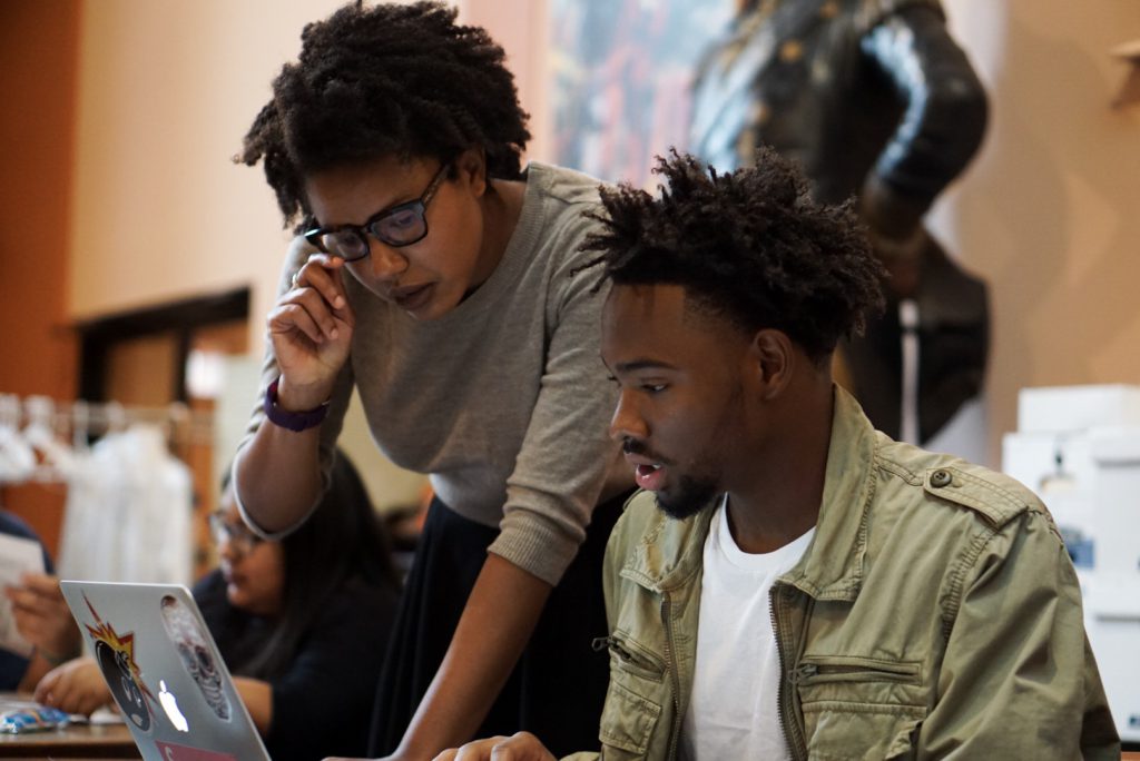 Graduate students at a computer