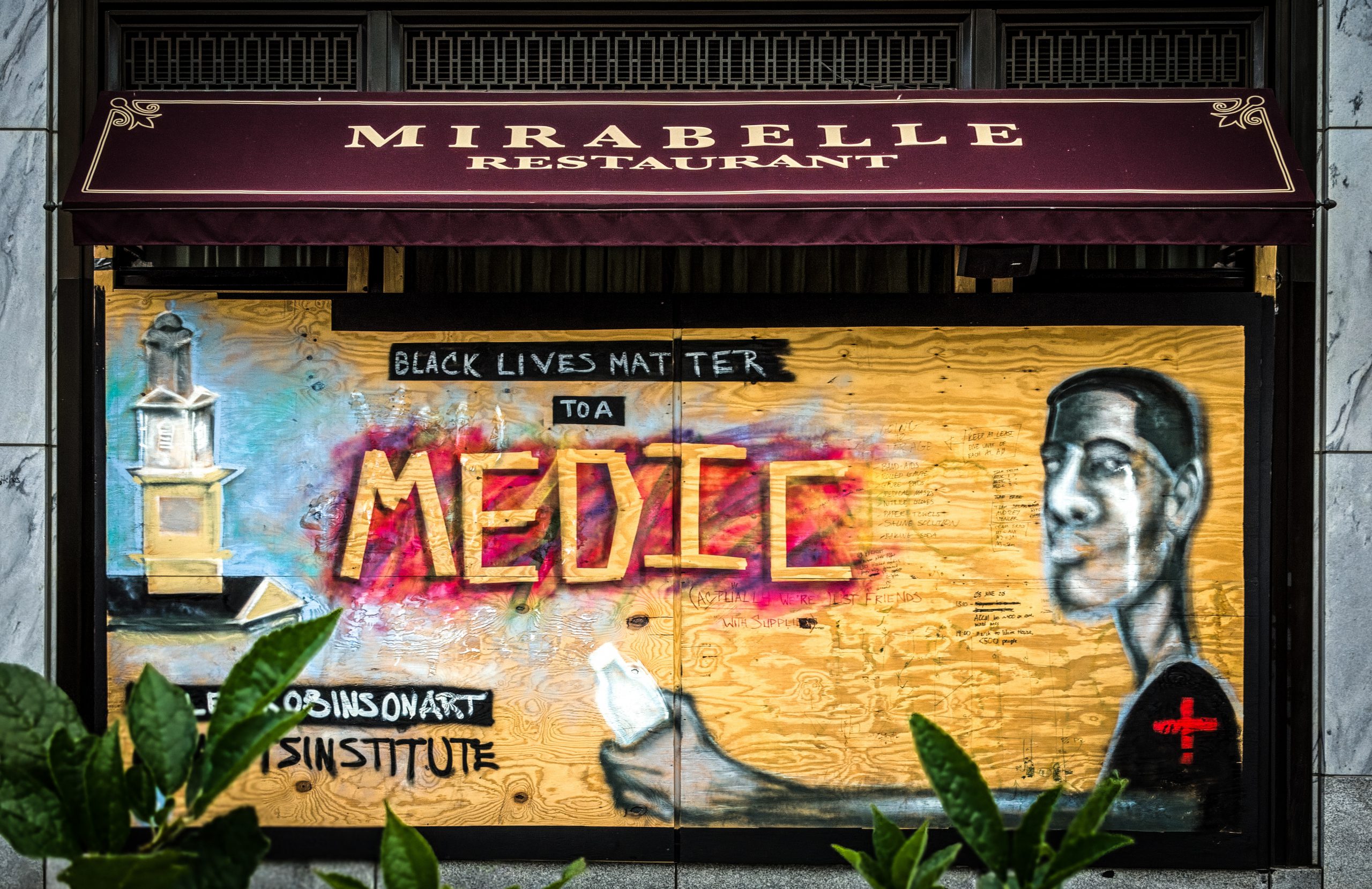 A mural in Washington DC depicts a life-saving Black Medic and the slogan Black Lives Matter.